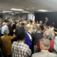 Worshippers at First Baptist Church in Atlanta surround Herschel Walker on Oct. 4, 2022.